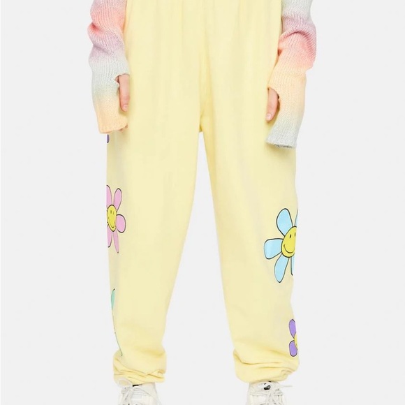 Zumiez Pants - BY SAMII RYAN X SMILEY LIL THANG YELLOW SWEATPANTS